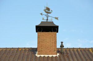 picture of chimney with decorative wind ornament